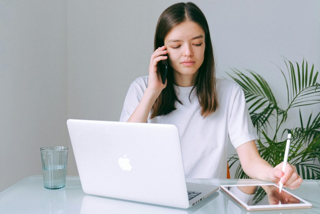 pexels-photo-3987034-3987034 Woman in White Crew Neck T-shirt Using Silver Macbook